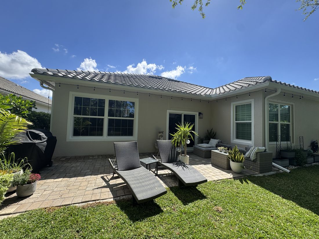 Before and after exterior repaint of a Cape Coral home